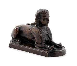 A Continental Grand Tour Patinated Bronze Sphinx
