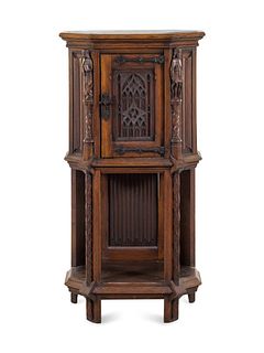 A Gothic Revival Carved Oak Cabinet