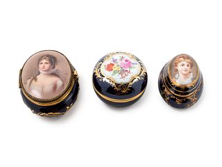 Three Continental Painted and Parcel Gilt Porcelain Boxes