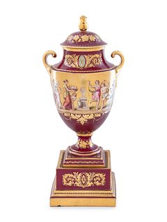A Vienna Style Painted and Parcel Gilt Porcelain Covered Urn