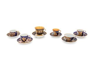 An Assembled Set of Six Sevres Style Painted and Parcel Gilt Porcelain Teacups and Saucers