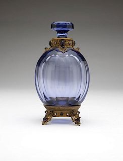 A brass-mounted lavender art glass decanter