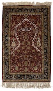 A Turkish Hereke Koum Kapi silk carpet