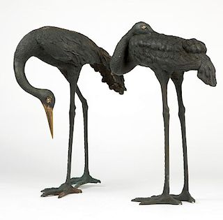 Two large Japanese bronze crane sculptures