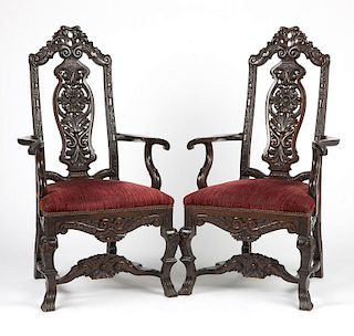 A pair of Continental carved wood armchairs