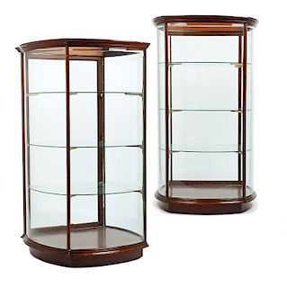 A pair of standing mahogany showcases