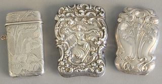 Three silver match boxes to include Tiffany sterling silver match safe, art nouveau style with flowers marked Tiffany & Co., ht. 2 1/4", one with nude