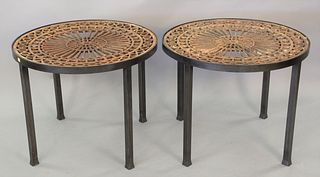 Pair of iron outdoor tables having Victorian wrought iron tops set on newer bases, ht. 23", dia. 28 1/2".