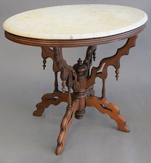 Oval Victorian marble top table, ht. 27 1/2", top 22" x 33 1/2".