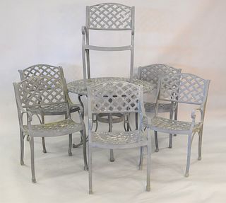 Eight piece outdoor patio set to include round table along with 6 armchairs and a side table, ht. 28", dia. 38".