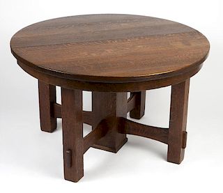 An oak Arts and Crafts dining table