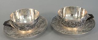 Chinese silver 4-piece lot to include 2 cups, 2 saucers dia. 5 1/2" marked with touchmark, having bamboo and floral decoration, 18.3 t.oz. .