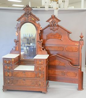 Two-piece walnut Victorian bedroom set with dropwell marble top chest, ht. 82", wd. 47", and high back bed, ht. 79".
