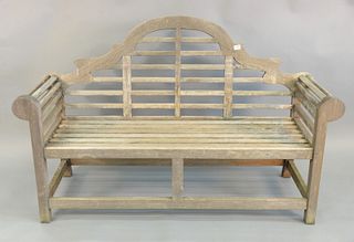 Outdoor teak bench having arch top and rolled arms, ht. 41', lg. 65".