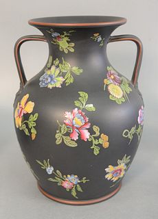 Large Wedgwood black basalt urn/vase, having two handles and enameled blossoming flowers, impressed Wedgwood mark on bottom. ht. 10". Provenance: The 