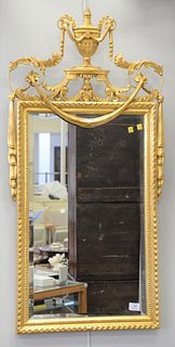 La Barge gilt mirror with carved pediment having urn, foliate motifs and swag, sticker on label verso, ht. 46 1/2", wd. 22 1/2".