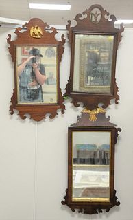 Three Chippendale style mahogany mirrors, 31 1/2" x 17"; 34" x 18 1/2" and 31" x 17 1/2".