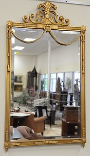 Pair of large majestic mirrors, gilt frames with carved tassel decoration, 48" x 27".