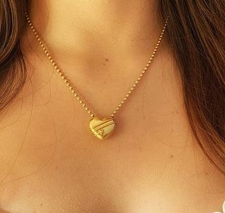 Tiffany & Co. 18K Gold cupid Heart arrow Pendant Necklace.