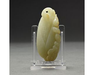 A PALE WHITE JADE CARVING OF CORN AND LION, CHINA