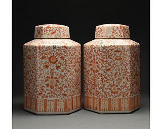 A PAIR OF IRON-RED GINGER JARS AND COVER,