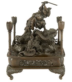 A JAPANESE BRONZE CANDLE STAND, MEIJI PERIOD (1868-1912)