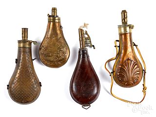 Three brass and copper powder flasks, 19th c.