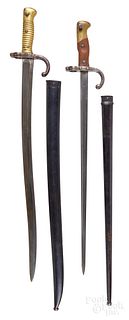 Two French sword bayonets with scabbards