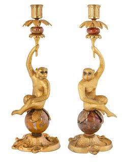 A PAIR OF FRENCH LOUIS XVI STYLE ORMOLU-MOUNTED RED ONYX MONKEY CANDLESTICKS, LATE 20TH CENTURY