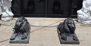 A Vintage Pair Of Bronze Recumbent Lion Sculptures
