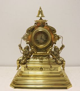 Antique Brass Figural Clock With Bell Finial.