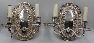 Pair of Caldwell Silvered Bronze Oval Sconces.