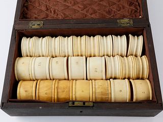 Two Sets of Cased Whaleman Made Whale Ivory Napkin Rings in Fitted Mahogany Box, 19th Century