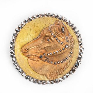 A STEEL BORDERED PATTERN BACKED HORSE HEAD BUTTON