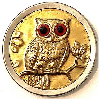 A DIVISION 1 SCARCE OWL HEAD BUTTON WITH GLASS EYES