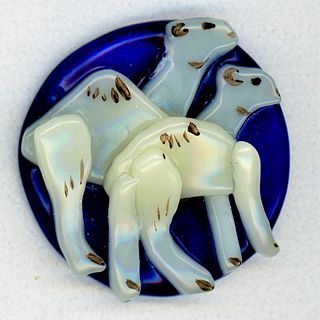 TWO BLUE BACKGROUND BUTTONS WITH CAMELS ON THEM
