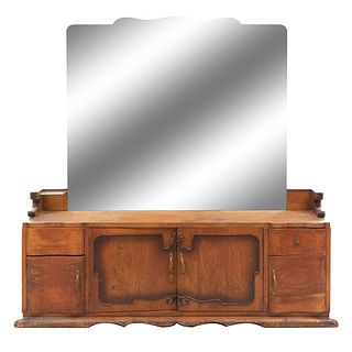 Tocador con espejo. SXX. En talla de madera. Con cubierta irregular, 4 puertas, 2 cajones y espejo de luna biselada. 172 x 175 x 40 cm.