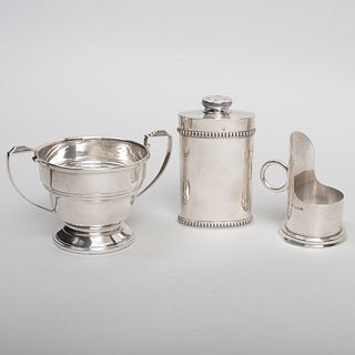 Asprey Silver Chamberstick, a French Silver Talcum Container and George V Silver Cup