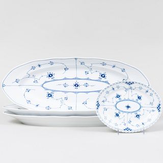Set of Three Royal Copenhagen Porcelain Platters in the 'Blue Fluted' Pattern and an Oval Porcelain Platter in the 'Blue Fluted Full Lace' Pattern
