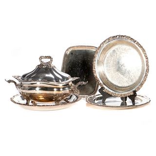 A grouping of silver plated serving pieces