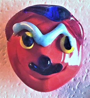 A RARE LAMPWORK MUSTSCHED MAN GLASS BUTTON