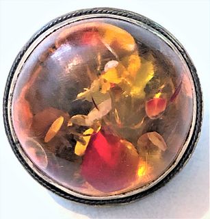 A VERY UNUSUAL HIGH DOMED GENUINE AMBER BUTTON IN METAL