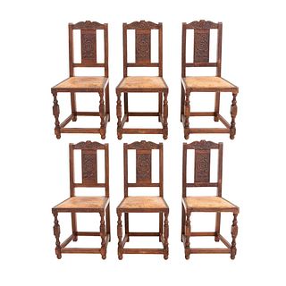 Lote de 6 sillas. Francia. Siglo XX. En talla de madera de roble. Con respaldos semiabiertos y fustes compuestos.