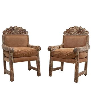 Pair of armchairs. 20th century. Carved in wood. Closed backrests with cushions and seats in camel upholstery.