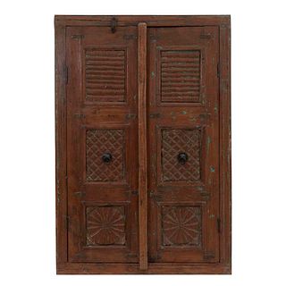 Cabinet. 20th century. Carved in wood. Two hinged doors with handles. Decorated with geometric elements. 40.5 x 27.5 x 6.6" (103 x 70 x 17 cm)