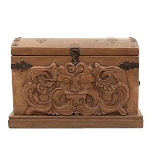 Chest. 20th century. Carved in wood. Hinged cover and plinth-type support. Decorated with zoomorphic figurehead.
