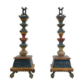 Pair of candleholders. 20th century. Polychrome wood carving. Bolted blacksmith washers, composite shafts. 64 x 21.6" (163 x 55 cm)
