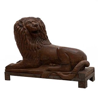 Lion. Carved in wood. Base.