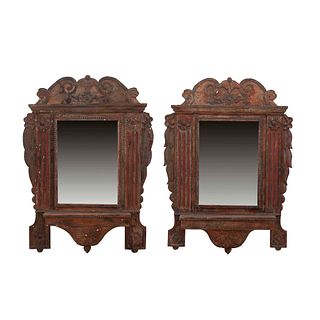 Pair of mirrors. 20th century. Wood. Decorated with plant, floral, organic elements. 58.2 x 42 x 5.9" (148 x 107 x 15 cm)