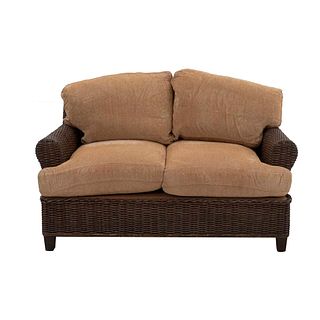 Loveseat. 20th century. Woven wicker, closed backrests and seats in beige upholstery.